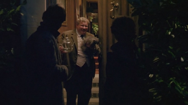 Withnail & I - Monty Richard Griffiths opens door holding gray cat to Withnail Richard E. Grant and Marwood Paul McGann