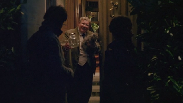 Withnail & I - Monty Richard Griffiths opens door holding gray cat to Withnail Richard E. Grant and Marwood Paul McGann