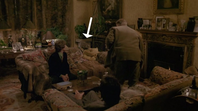 Withnail & I - Monty Richard Griffiths chasing away gray cat from couch with Withnail Richard E. Grant and Marwood Paul McGann