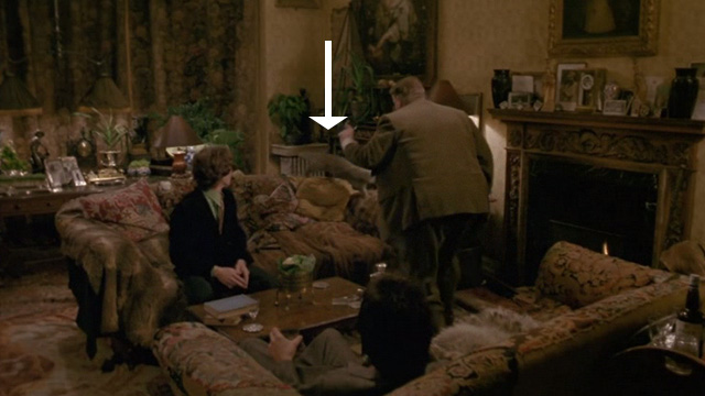 Withnail & I - Monty Richard Griffiths chasing away gray cat from couch with Withnail Richard E. Grant and Marwood Paul McGann