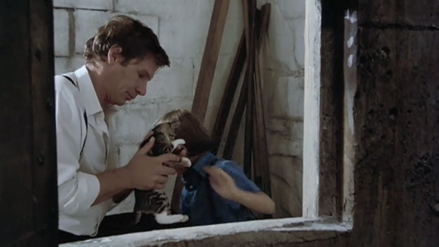 Witness - Samual Lukas Haas handing tabby kitten to John Book Harrison Ford outside grain silo