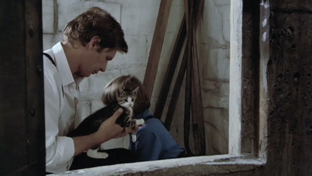 Witness - John Book Harrison Ford holding tabby kitten outside grain silo