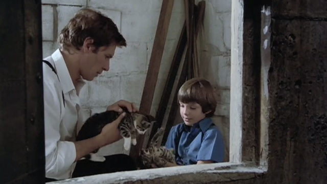 Witness - Samual Lukas Haas holding tabby kitten upside down with John Book Harrison Ford also holding kitten outside grain silo