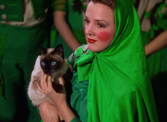The Wizard of Oz - Emerald City woman Helen Seamon holding Siamese cat