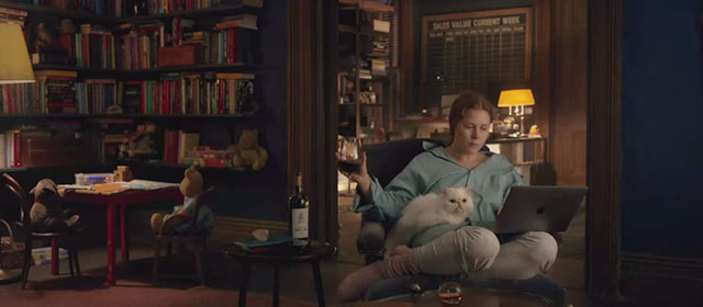 The Woman in the Window - white Persian cat Punch sitting on lap of Anna Amy Adams
