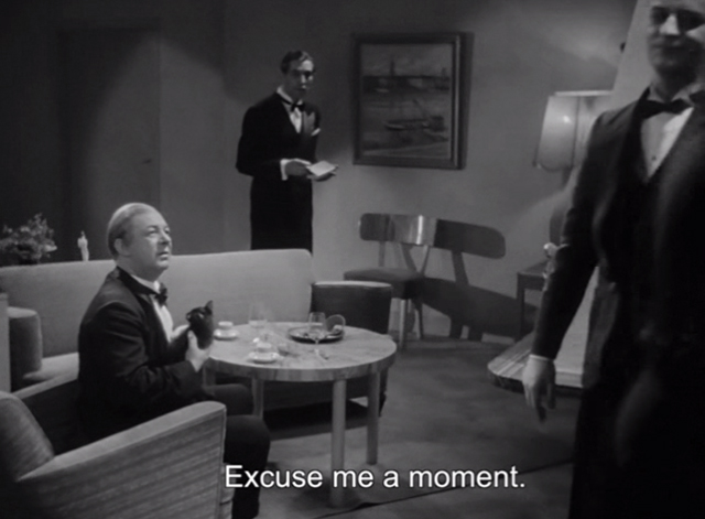 A Woman's Face - men and Nyman Erik Berglund holding black kitten