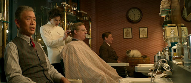 Wonka - Timothée Chalamet in barber shop with customers and Himalayan cat