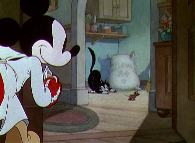 The Worm Turns - Mickey Mouse looking at black and white cartoon cat chasing mouse
