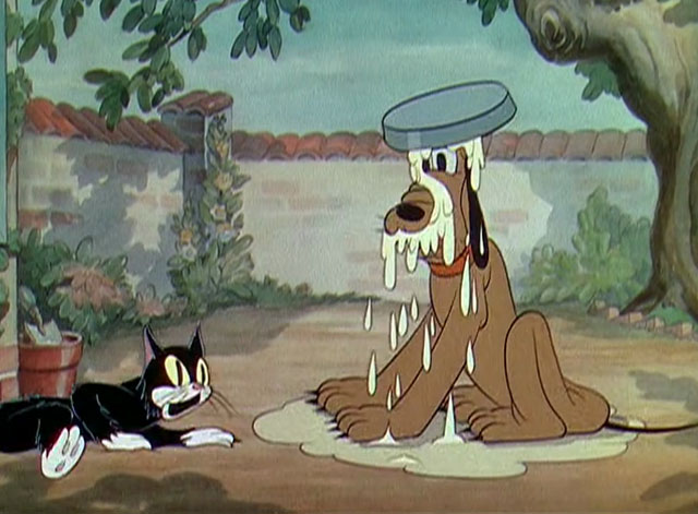 The Worm Turns - black and white cartoon cat looking shocked after spilling milk on dog Pluto