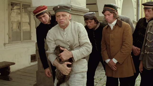Woyzeck - Woyzeck Klaus Kinski holding onto tabby cat in front of male students