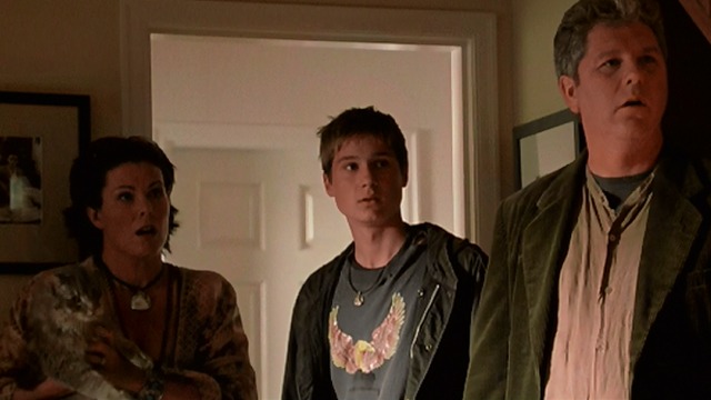 X-Men 2 - Maine Coon cat in the arms of Iceman's mother with father and brother