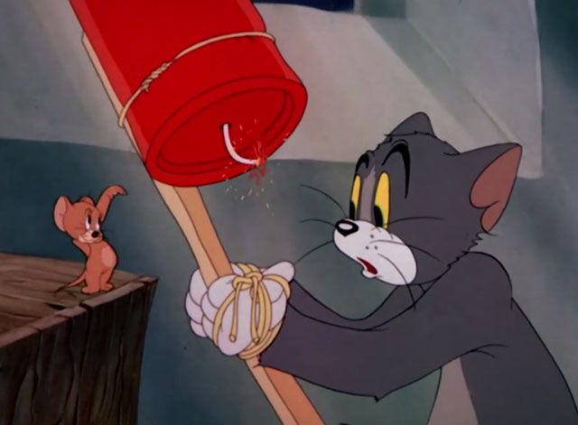 The Yankee Doodle Mouse - Tom cartoon cat with hands tied to rocket being waved at by Jerry mouse