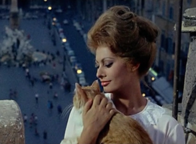 Yesterday, Today and Tomorrow - Mara holding orange and white cat