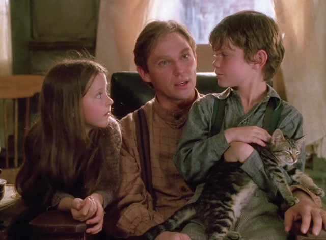Yes Virginia, There is a Santa Claus - James O’Hanlan Richard Thomas with Sean John Kirkconnell and Katharine Isabelle sharing chair with brown tabby kitten Nicky