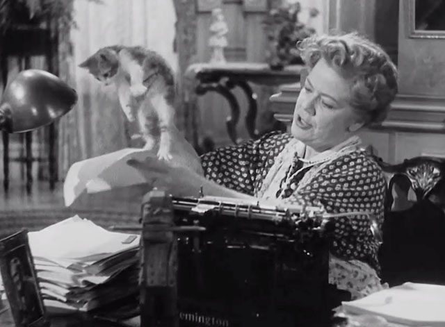 You Can't Take it With You - Penny Spring Byington lifting bicolor tabby kitten from manuscript