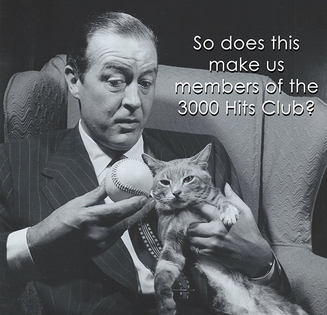 Ray Milland and cat Rhubarb with baseball