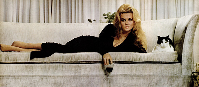 Ann-Margret with cat on couch