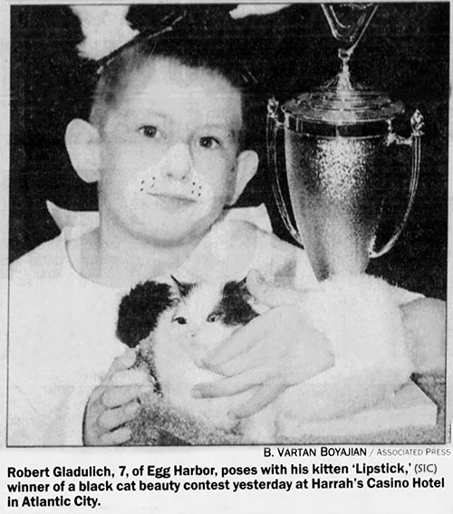 Calling All Black Cats - newspaper photo of Robert Gladulich and his cat Dipstick