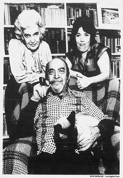 Milton Merlin with Siamese cat Caspar, wife Barbara and daughter Sally Merlin-Jones