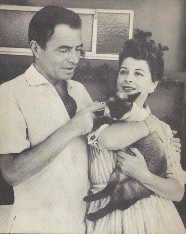 Pamela and James Mason with Siamese cat