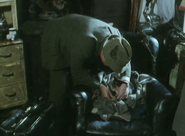 One Step Beyond - Siegried Robert Hardy tending to injured tortoiseshell cat on chair