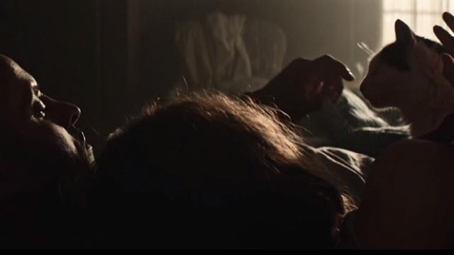 American Gods - Git Gone - long-haired tuxedo cat Dummy in bed with Laura Emily Browning and Shadow Ricky Whittle