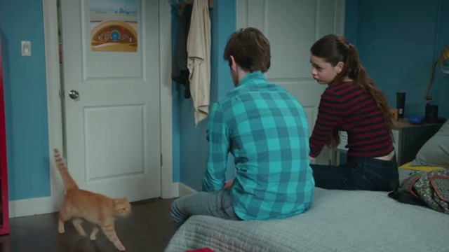 American Housewife - Grandma's Way - ginger tabby cat Mittens entering bedroom and approaching Oliver Daniel DiMaggio and Gina Nikki Hahn