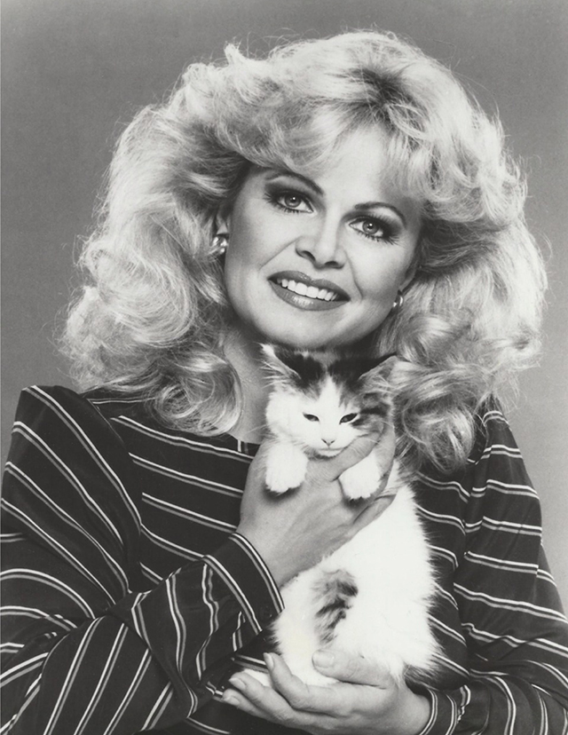 Gloria promotional photo - Sally Struthers holding calico kitten