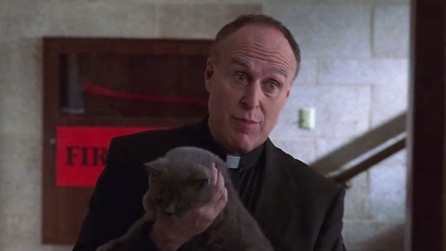 Boston Legal - Gone - Father Michael Ryan Richard Fancy holding shorthaired gray cat