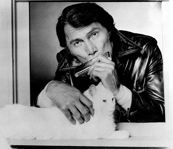 Bronk - Alex Bronkov Jack Palance in window with harmonica and white longhair cat Yankee
