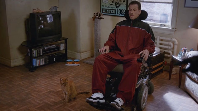 Brooklyn Nine-Nine - Terry Kitties - Dimitri Kuzkho Andrew Oilveri in wheelchair with red tabby cat beside him