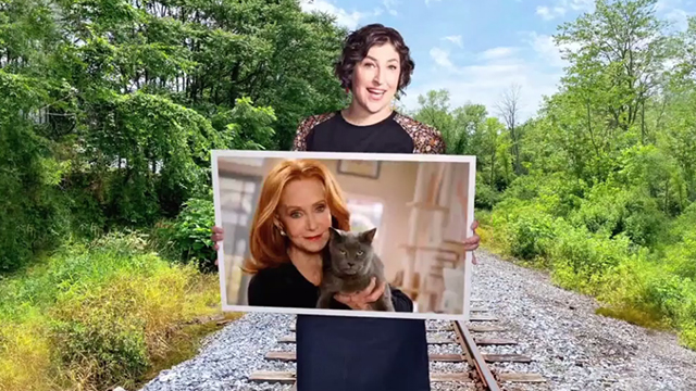 Call Me Kat - Plus One - Kat Mayim Bialik holding photo of Sheila Swoosie Kurtz with grey blue cat