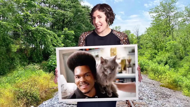 Call Me Kat - Plus One - Kat Mayim Bialik holding photo of Carter Julian Gant with longhair gray cat