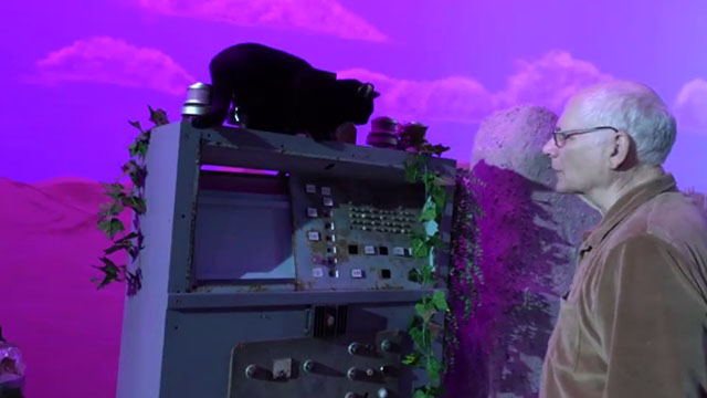 Cosmic Cat - black cat Penny on top of computer with Will Bill Hedges