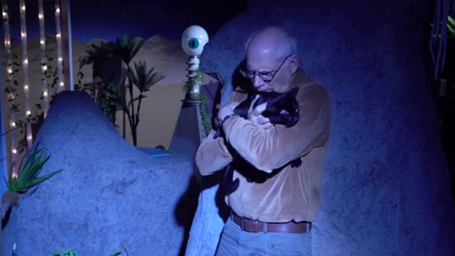 Cosmic Cat - black cat Penny being held by Will Bill Hedges