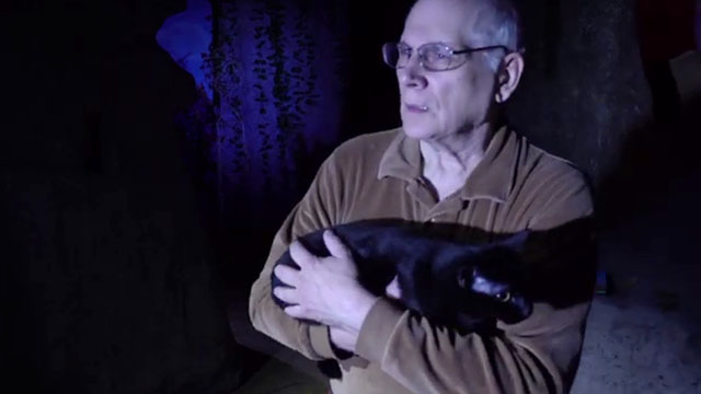 Cosmic Cat - black cat Penny held by Will Bill Hedges