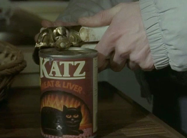 Cracker - To Be a Somebody - close up of fake tin of cat food being opened