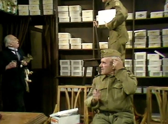 Dad's Army - Boots, Boots, Boots - Sgt. Wilson John Le Mesurier with shoe shop keeper Mr. Sedgewick Erik Chitty holding longhair tabby cat