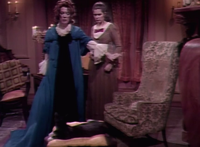Dark Shadows - Natalie Grayson Hall and Victoria Alexandra Moltke looking at tuxedo cat on ottoman