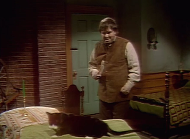 Dark Shadows - Ben Thayer David approaching tuxedo cat on bed with axe