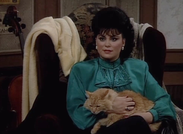 Designing Women - Mr. Bailey - long haired ginger tabby cat held by Suzanne Delta Burke