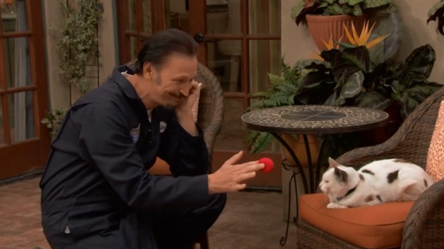 Ralph Steve Valentine does sleight of hand for cat actor Frosty as Stan