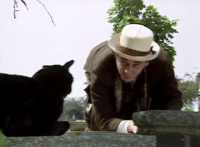 Doctor Who - Survival - Dr. Who Sylvester McCoy approaching black cat Kitling on wall