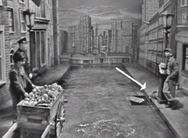 The Ernie Kovacs Show - long-haired tabby cat on sidewalk with newspaper salesman during day