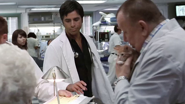 ER - Tandem Repeats - Frank Troy Evans holding ginger tabby kitten Purdy with Tony John Stamos