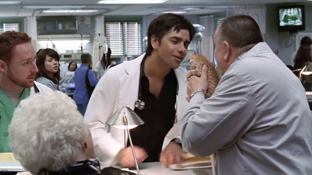 ER - Tandem Repeats - Frank Troy Evans holding ginger tabby kitten Purdy with Tony John Stamos