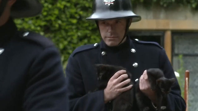Father Brown - The Theatre of the Invisible - fireman carrying black kittens to safety