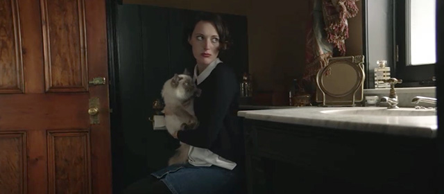 Fleabag - Episode 1.5 - Fleabag Phoebe Waller-Bridge holding ragdoll cat Felicity on toilet