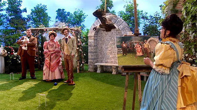 The Goes Wrong Show - Harper's Locket - Bernard Robert Henry Lewis holding white Persian cat on lawn with Celeste Sandra Charlie Russell, Edwin Chris Henry Shields and Emily Annie Nancy Zamit