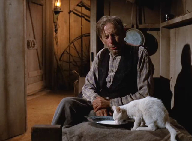 Gunsmoke - The Thieves - Louie Pheeters James Nusser sitting with white cat drinking milk from saucer